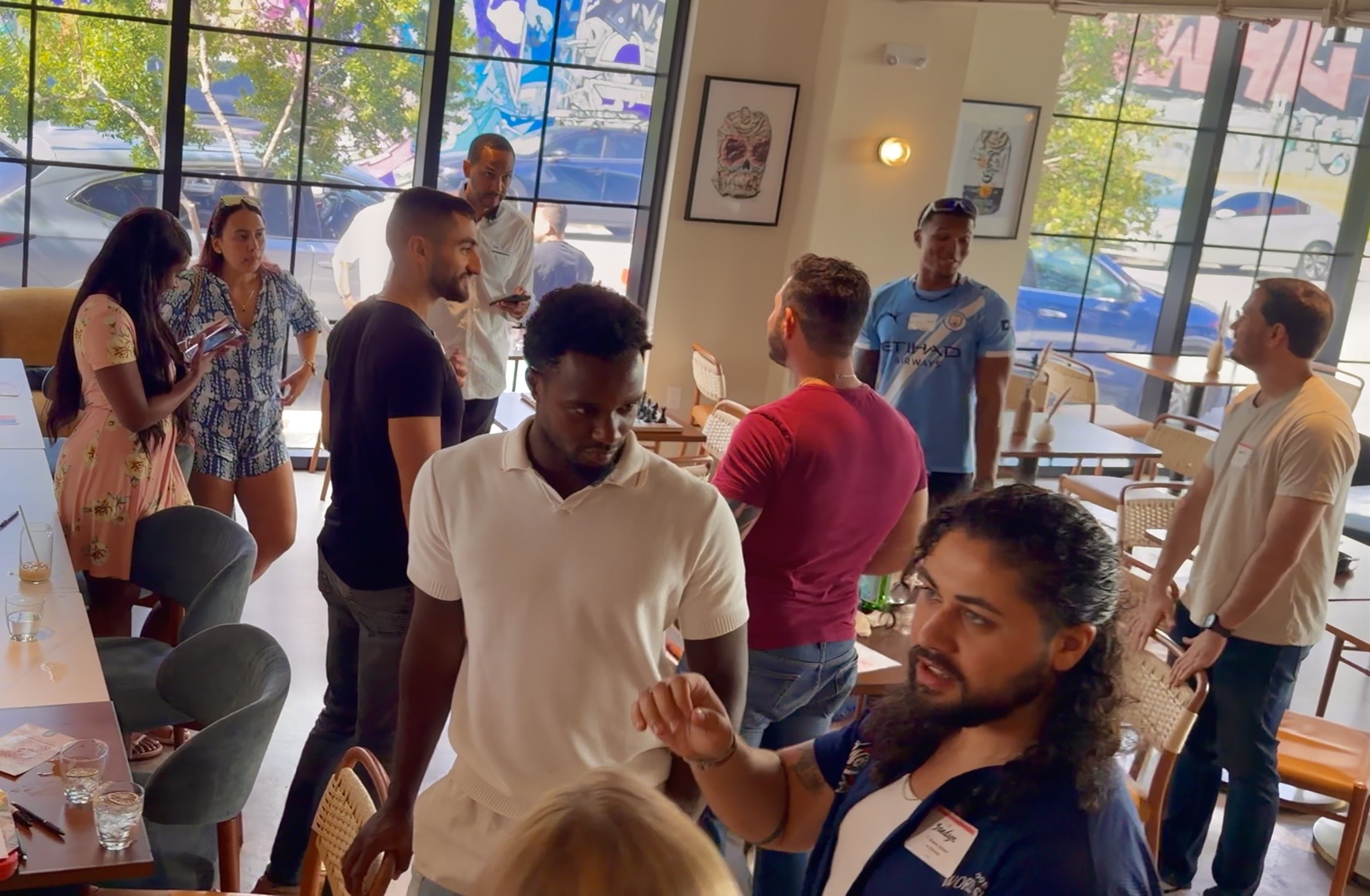 Guests mingling and talking at a Convive social in Miami